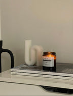 Luxury botanical candle styled in calming neutral home interior